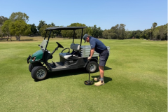 Trimming-fairway-distance-markers-on-The-Palms-golf-course