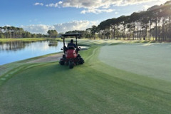 Mowing-the-green-apron-on-the-10th-hole-on-The-Pines-golf-course