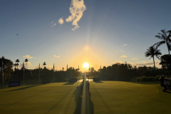 Mowing-the-putting-green-on-The-Palms-golf-course-at-sunrise