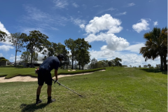 Trimming-irrigation-sprinkler-heads-on-The-Palms-golf-course