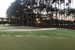 Sunlight-coming-through-the-trees-on-the-3rd-green-of-The-Pines-golf-course