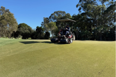 Verti-cutting-The-Palms-golf-course-greens-with-the-14th-hole-shown