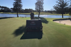 Needle-tine-aeration-on-the-12th-green-of-The-Pines-golf-course