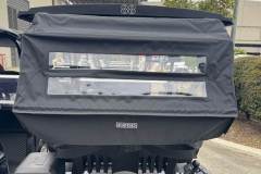 Magnetic rear bag covers that fold neatly beneath the top assembly. 